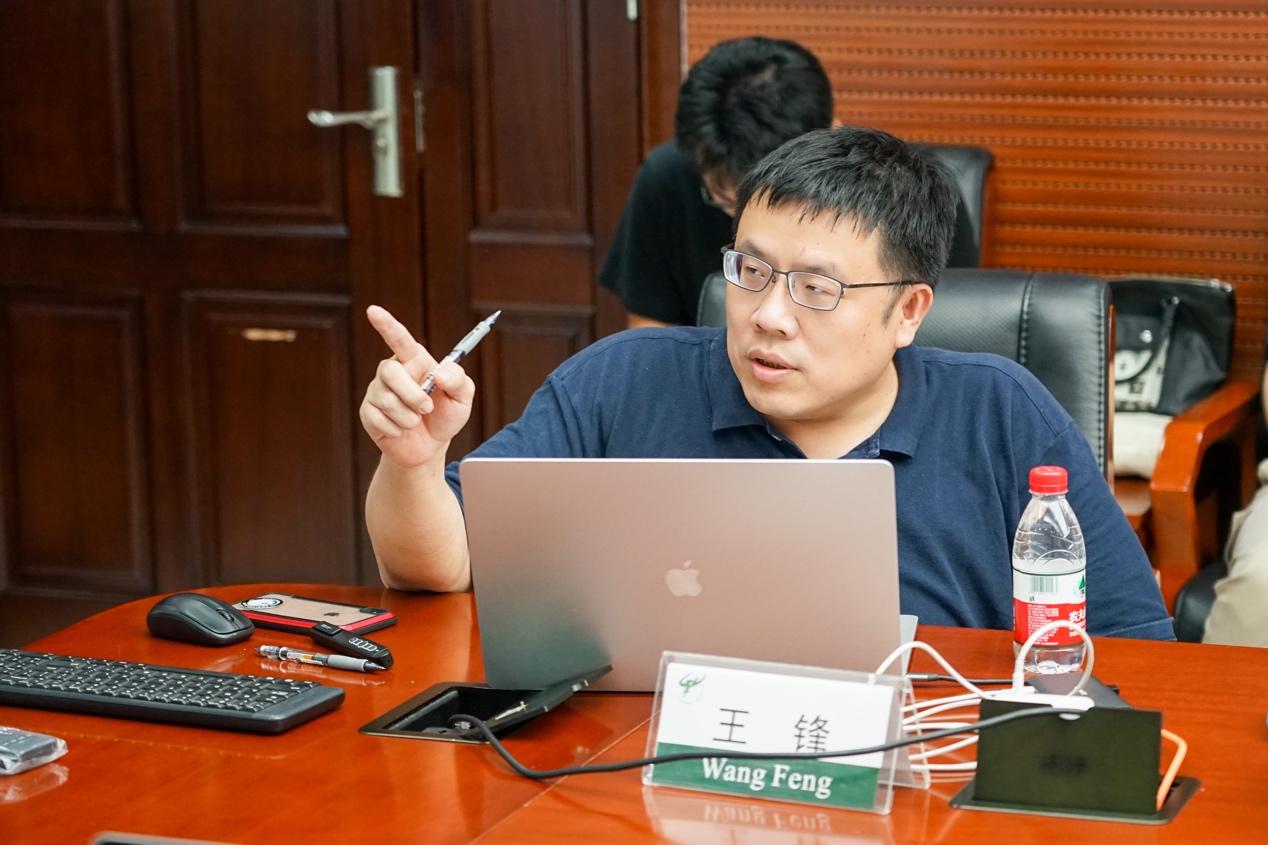 A person sitting at a table with a computer and a penDescription automatically generated with low confidence A person sitting at a table with a computer and a penDescription automatically generated with low confidence